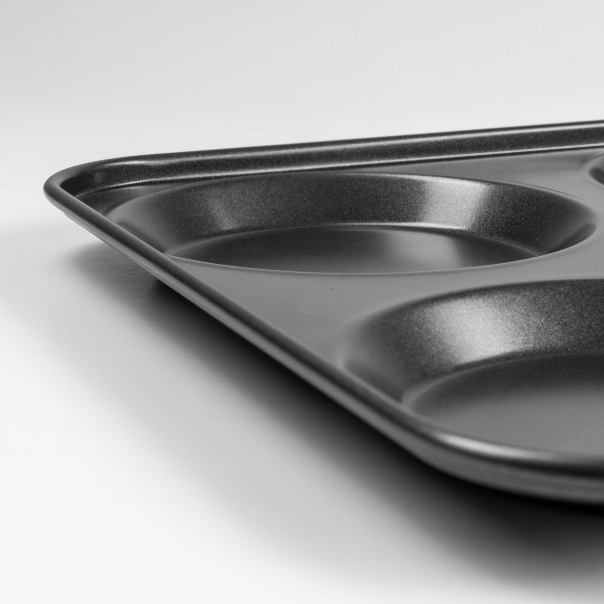 Metal Yorkshire pudding tray on a white background