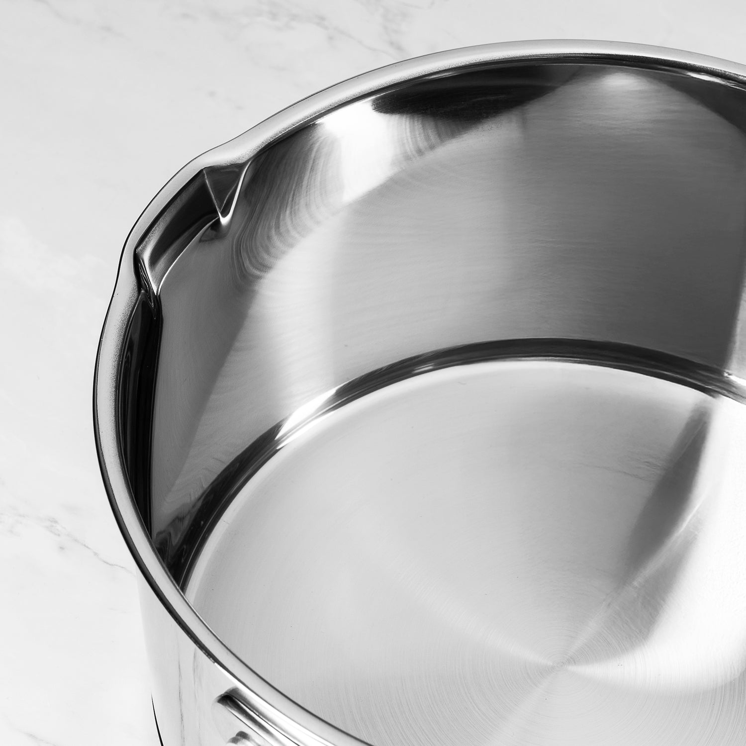 Close-up of a stainless steel pan on a light background