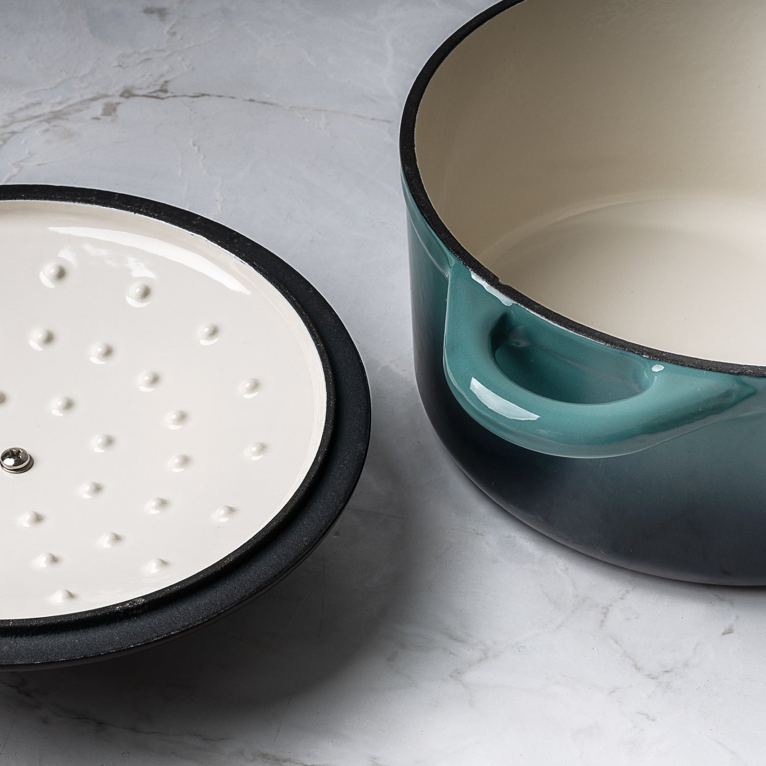 ProChef round cast iron casserole dish in teal with white enamel interior, shown with lid underside featuring self-basting condensation rings