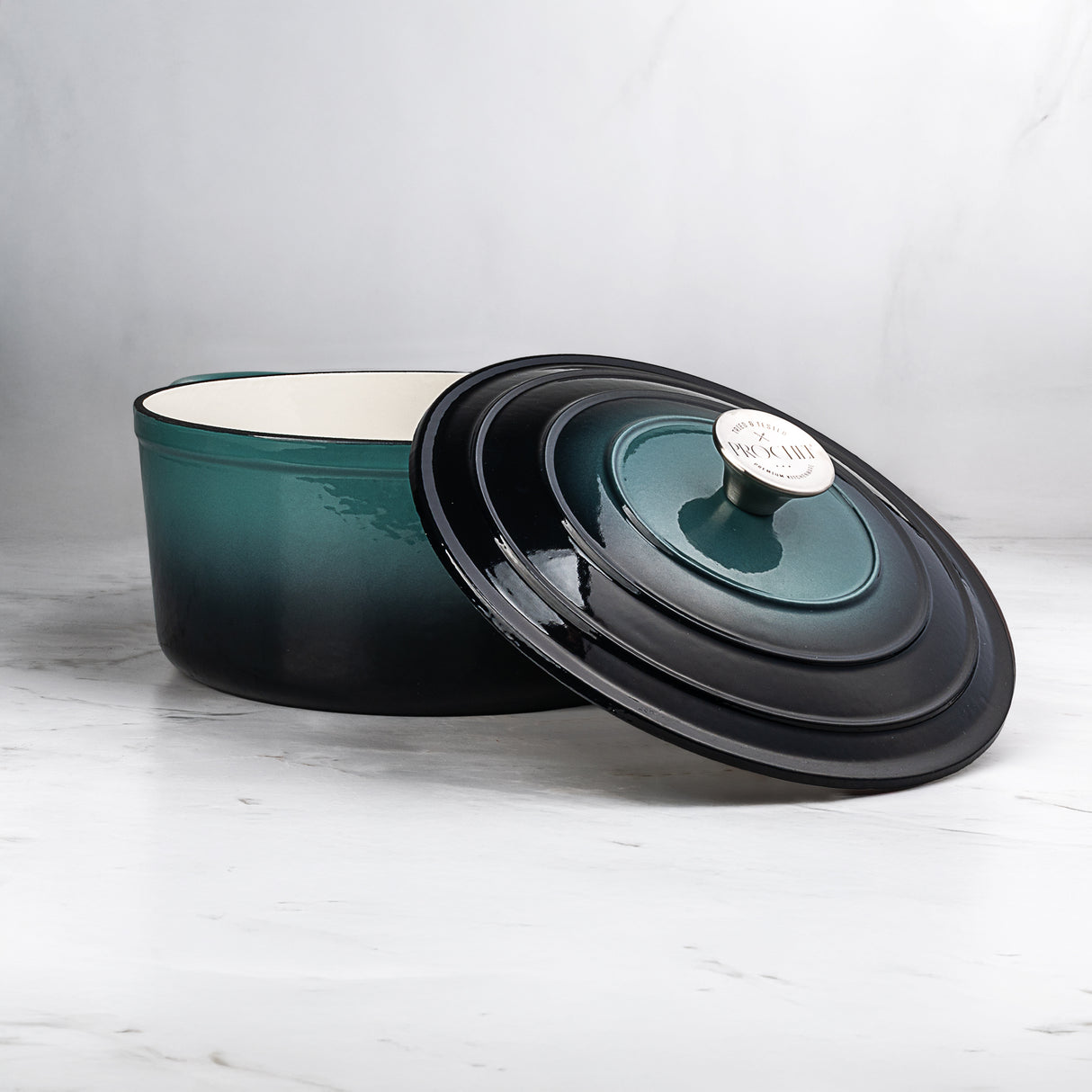 ProChef deep teal enamel cast iron casserole dish with matching lid on a light gray background