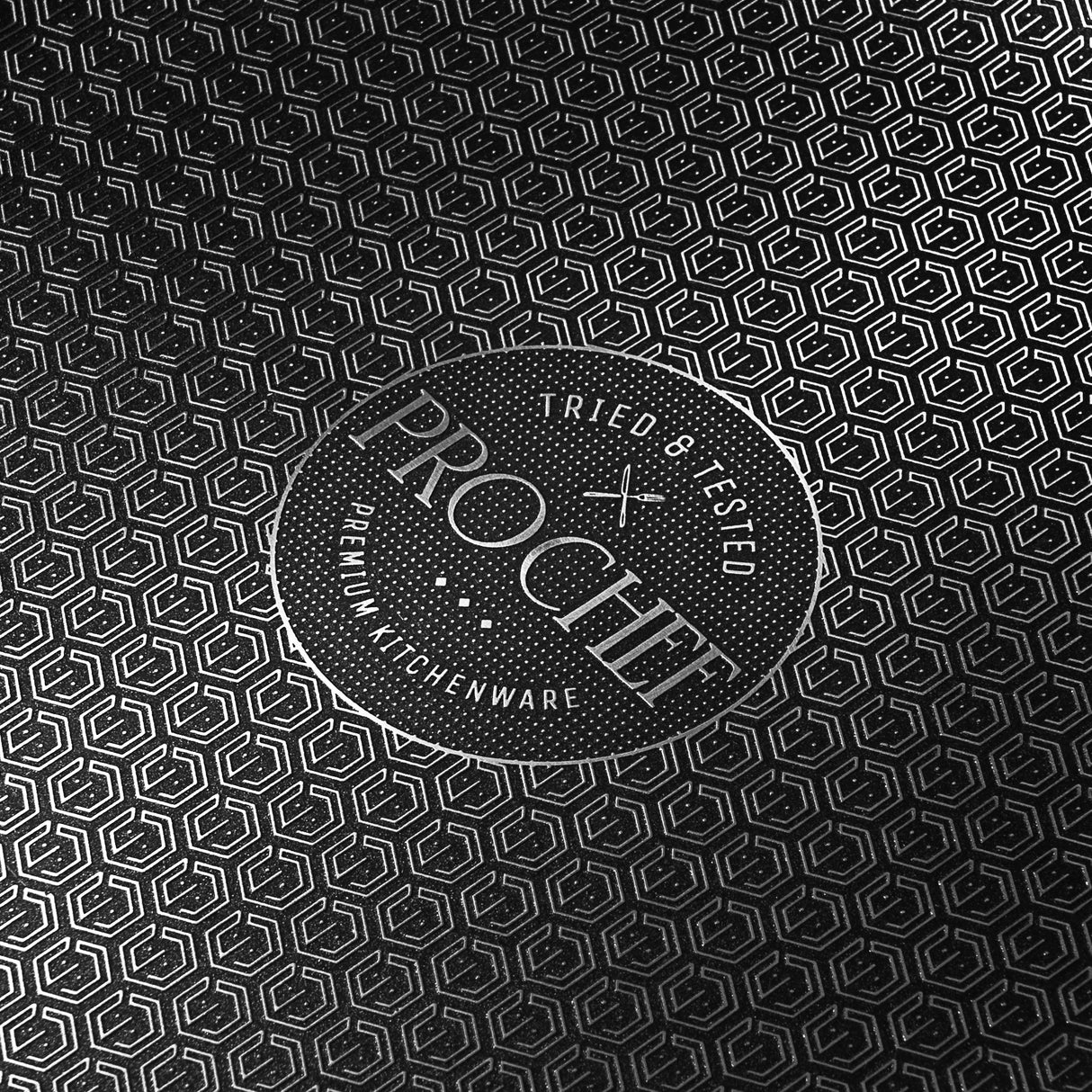 Close-up of Prochef HexGuard non-stick cooking surface with textured hexagonal pattern and Prochef premium kitchenware logo, highlighting durability and design.