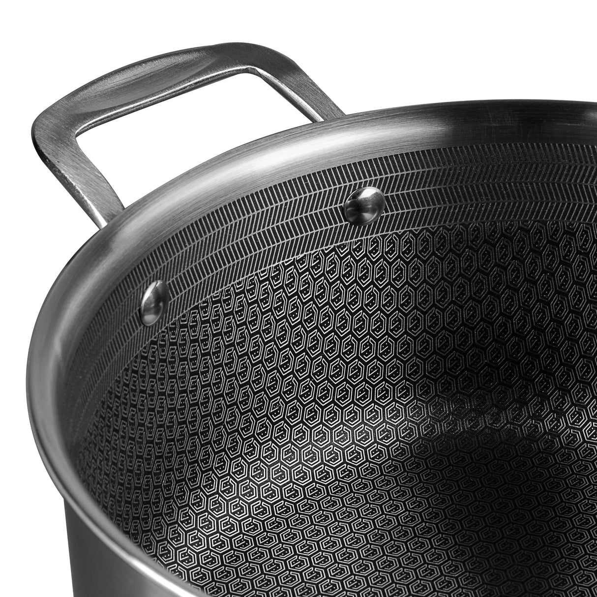 Close-up of a black pot with a textured surface and silver handle on a white background
