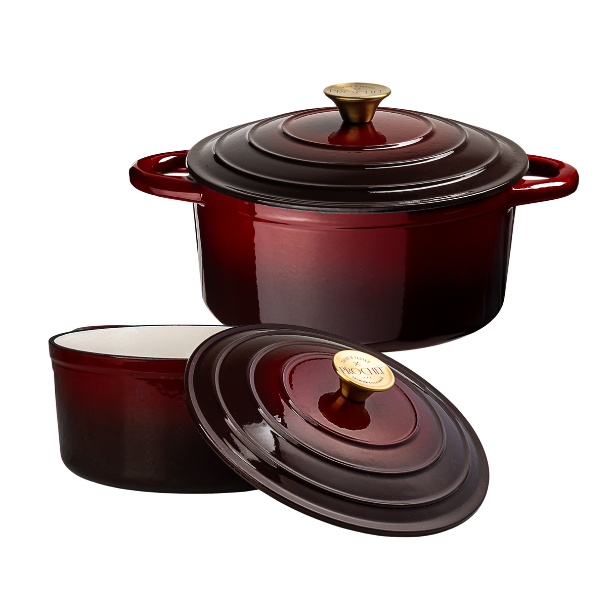 Red enameled cast iron cookware set with lids on a white background