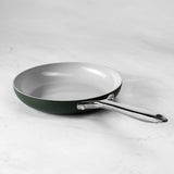 ProChef green aluminium frying pan with a white non-stick coating on a white marble surface
