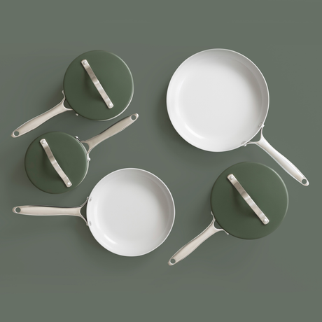 Set of ProChef green and white pans on a dark green background
