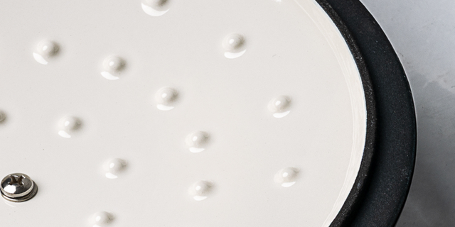 Close-up of the inside of a casserole dish lid with textured modules and black rim