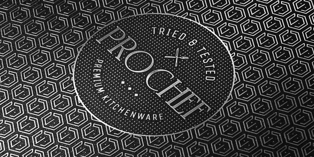 Close up of a HexGuard pan cooking surface with an embossed ProChef logo 