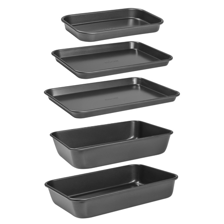 Set of five black baking trays and roasting tins on a white background