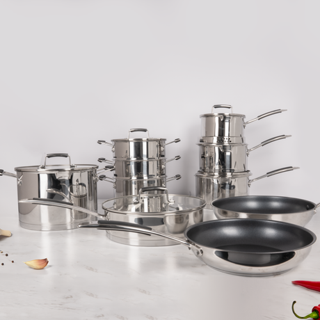 Set of stainless steel cookware on a white background